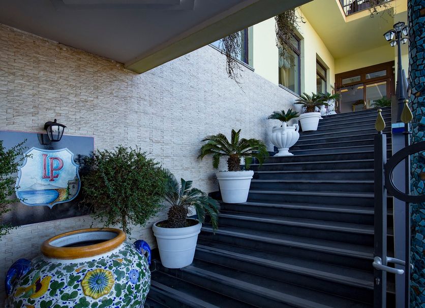 La Panoramica Hotel in Castellammare di Stabia, stairway with potted plants and decorative ceramic planter