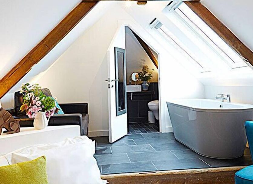 Live and Let Live Inn in Totnes attic bathroom with freestanding tub and skylight