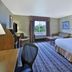 Hampton Inn Pittsburgh Area-Beaver Valley-Ctr Township room with king bed, sofa, desk and window view in Monaca