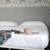 Hotel Boutique Hc Maga in Puerto de la Cruz, double bed with floral headboard, hat and clothing
