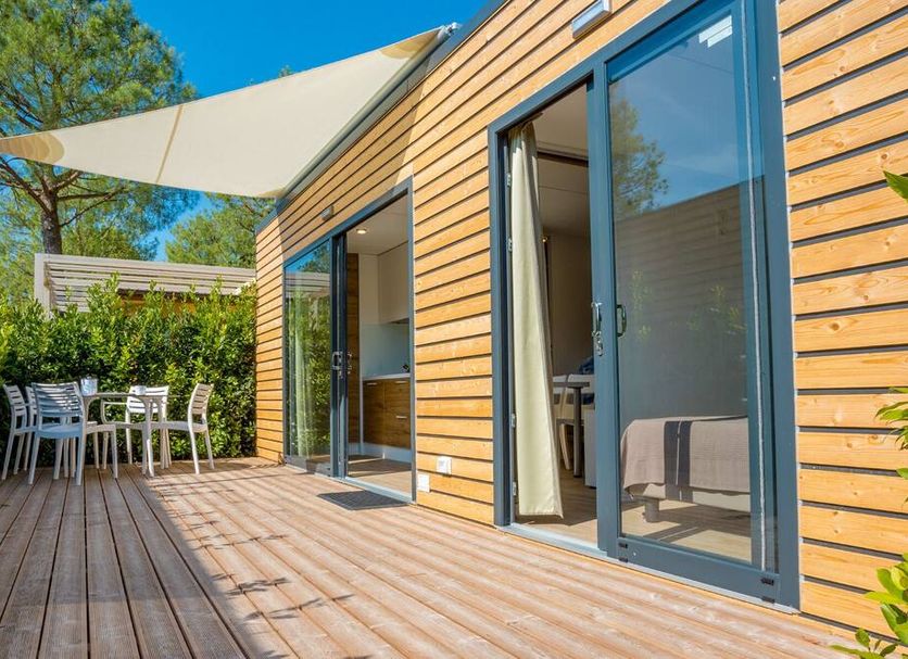Concept Village Piccola Gardiola in San Felice del Benaco, wooden terrace with sliding glass doors and shaded patio
