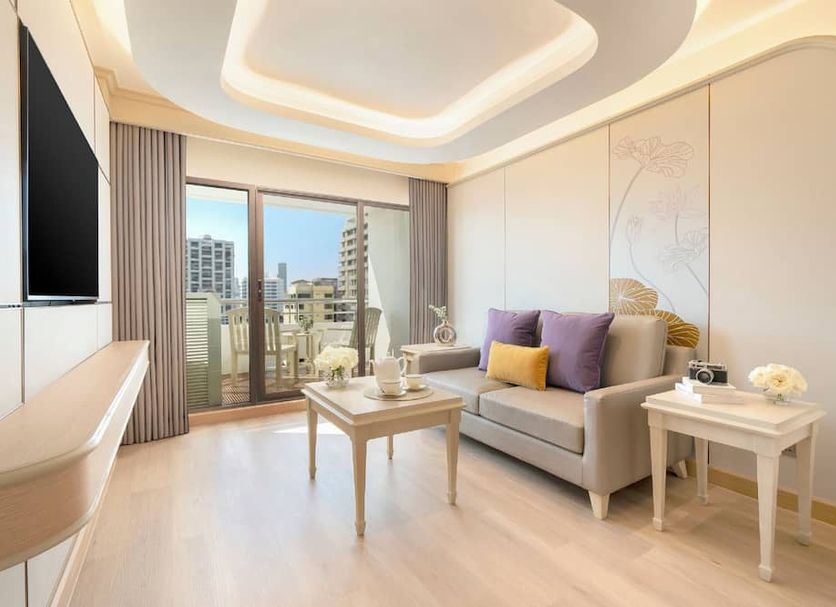 Centre Point Sukhumvit 10 Bangkok living room with balcony view and sofa seating