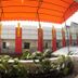 The Packer Lodge Yogyakarta in Yogyakarta, balcony view with orange awning and potted plants