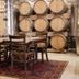 Posada Mayor de Migueloa, Laguardia: rustic dining room with wine barrels and wooden table