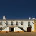 Monte Dos Apóstolos in Portalegre, white facade hotel with arched doorways and twin staircases