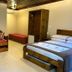 Pousada Charm Canela room in Canela with bed, sofa, wardrobe and small bench