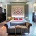 The Lalit London, London: elegant suite with tufted sofa, canopy bed and ornate ceiling