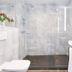 Living Hotel an der Oper Vienna bathroom with glass shower, wall-mounted toilet and vanity sink