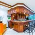 Radisson Hotel Trinidad bar lounge with high stools and wood-paneled counter in Port of Spain