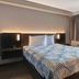 Studio 6-Jacksonville, Fl - Baymeadows room with queen bed, window, and bedside lighting in Jacksonville