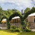 Hotel Waldesruh Am See in Aumühle with ivy-covered arches, terrace, and garden seating