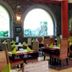 Hotel Spa La Central - Adults Only dining room in Maçanet de Cabrenys with arched windows and set tables