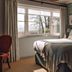 The Alfriston, Polegate: cozy guest room with king bed and countryside view through large window