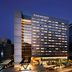 Four Points by Sheraton Seoul Guro in Seoul at dusk with illuminated windows and street view