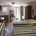 Il Borgo di Campi, Riomaggiore: room with three single beds, kitchenette, and balcony door
