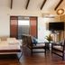 First Landing Beach Resort and Villas in Viseisei: airy villa room with bed, seating area and TV.