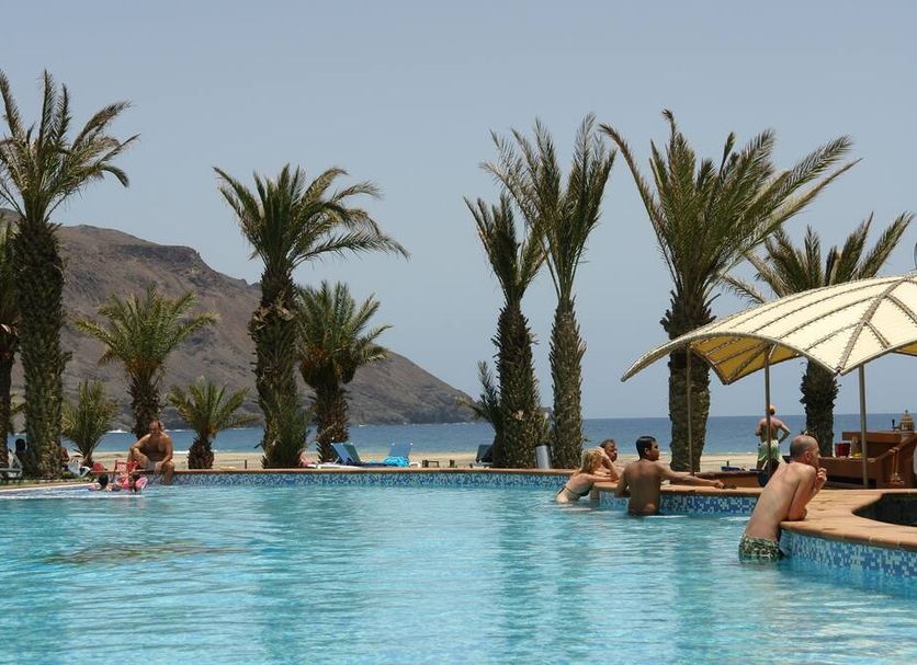 Foya Branca by Flagworld Hotels in São Pedro: pool with palm trees and ocean view