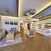 Riu Palace Costa Mujeres in Cancún, spacious guest room with king bed, sofa seating and modern lighting