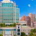 Dongguan Huaxi International Hotel in Dongguan, exterior view of a tall hotel tower against a blue sky