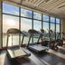 Oakwood Residence Saigon gym in Ho Chi Minh City with treadmills, ellipticals and floor-to-ceiling windows
