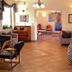Albergo Giardino lobby in Balatongyörök with tiled floor, seating, piano and floral arrangements