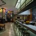 Hilton Skanes Monastir Beach Resort in Monastir with modern bar seating and colorful restaurant lighting