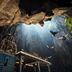 OYO 90151 Hill Inn Batu Caves near Batu Caves temple inside a dramatic cave with sunbeams and birds