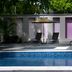 Hb CÓrdoba hotel pool with lounge chairs and umbrellas in Córdoba
