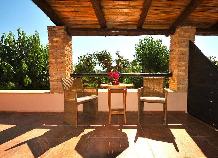 Elia Hotel & Spa, Kolymvari: shaded terrace with table, chairs and garden view
