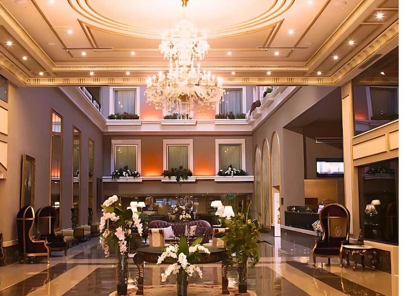 Euro Park Otel Istanbul lobby with chandelier, high ceiling, floral arrangements and seating area