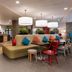 Home2 Suites by Hilton Anchorage/Midtown lobby with seating area and pendant lights in Anchorage