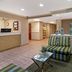 La Quinta Inn & Suites by Wyndham Sawgrass lobby seating area in Sunrise with front desk