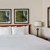 La Quinta Inn & Suites by Wyndham Sawgrass in Sunrise, guest room with king bed and bedside lamps