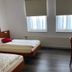 Weserlounge Hotel Garni guest room in Hessisch Oldendorf with two single beds, desk, and windows