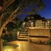 Porto Pacuíba Hotel in Ilhabela with a lit wooden deck and elevated terrace at night