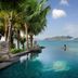 Mandarin Oriental, Sanya infinity pool with ocean and island views, framed by palm trees