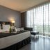 Eurostars Palace, Córdoba: modern hotel room with king bed, chaise lounge and floor-to-ceiling window