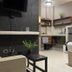 Ocean Breeze Santo Domingo guest room with bed, TV, desk, and kitchenette