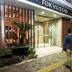 Tokyu Stay Shimbashi Tokyo hotel entrance with two guests arriving at dusk
