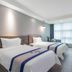 Xiamen Junming Hotel in Xiamen, twin guest room with two beds and large window