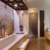 Le Jardin Villas Seminyak bathroom in Kuta with soaking tub, double sink vanity and walk-in shower