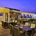 Hotel Vijay Parkinn, Gandhipuram, Coimbatore rooftop terrace dining with tables and city night views