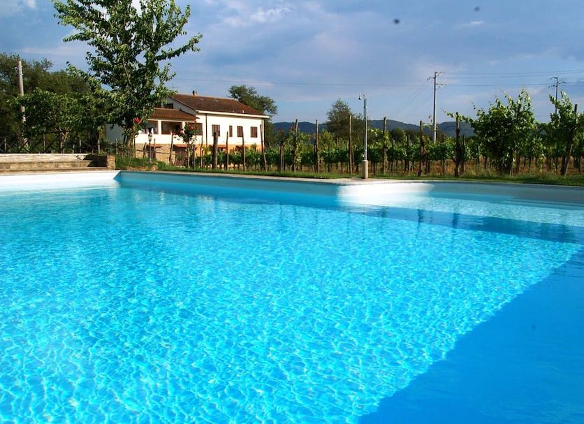 Borgo Nuovo San Martino in Ambra with a large outdoor swimming pool and garden view
