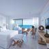 Abaton Island Resort & Spa in Hersonissos suite with ocean view and sliding glass doors