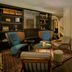 The Nikolai Hamburg lobby lounge in Hamburg with armchairs, bookshelves and a small table
