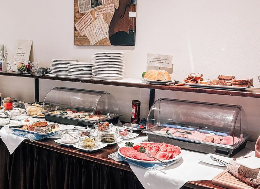 Hotel International am Theater in Münster breakfast buffet with pastries, fruit, and cold dishes