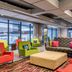 Aloft Panama in Panama City lobby lounge with colorful armchairs, sofa, and large windows