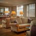 The Arden Hotel in Stratford-upon-Avon lounge with beige sofas, table lamps and window blinds