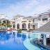Vinpearl Wonderworld Phu Quoc in Phu Quoc with a large lagoon-style pool and white resort buildings