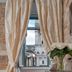 Heritage Hotel Antique Split room with draped window view of Split historic architecture